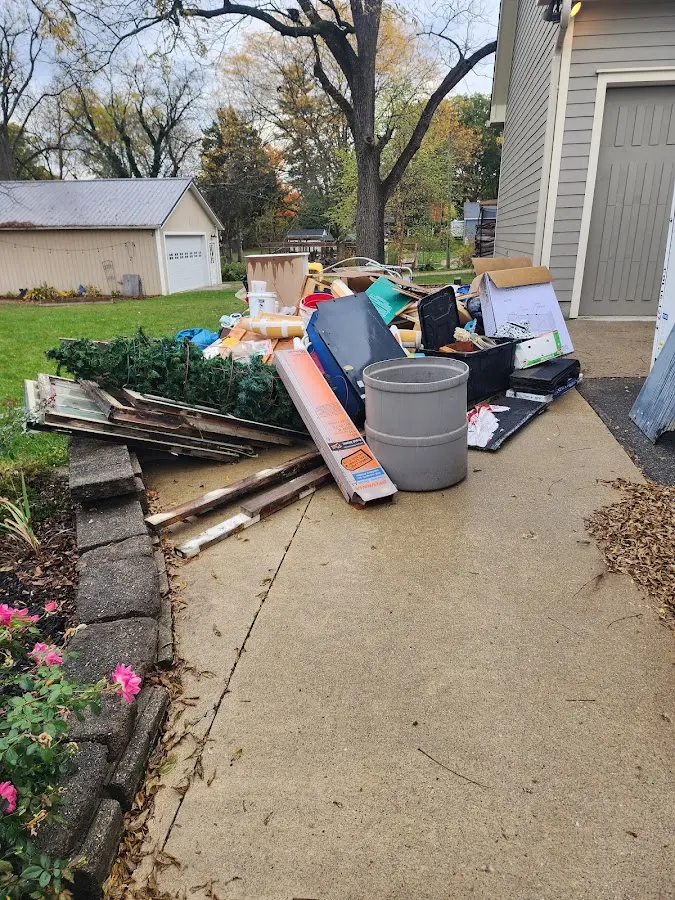 Dumpster being loaded with debris for Commercial Dumpster Rental in Ticonderoga